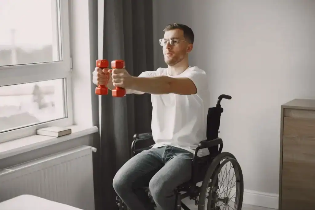 Image of man doing exercise in his wheelchair to aid weight loss Maplehurst