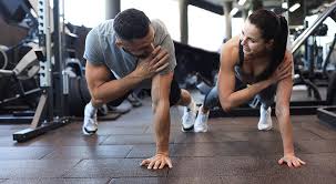 Sculpting Sleek Arms: The Essential Role of Cardio in Toning Without Bulking Up 1 Image of man and woman doing Cardio Maplehurst to tone their arms.